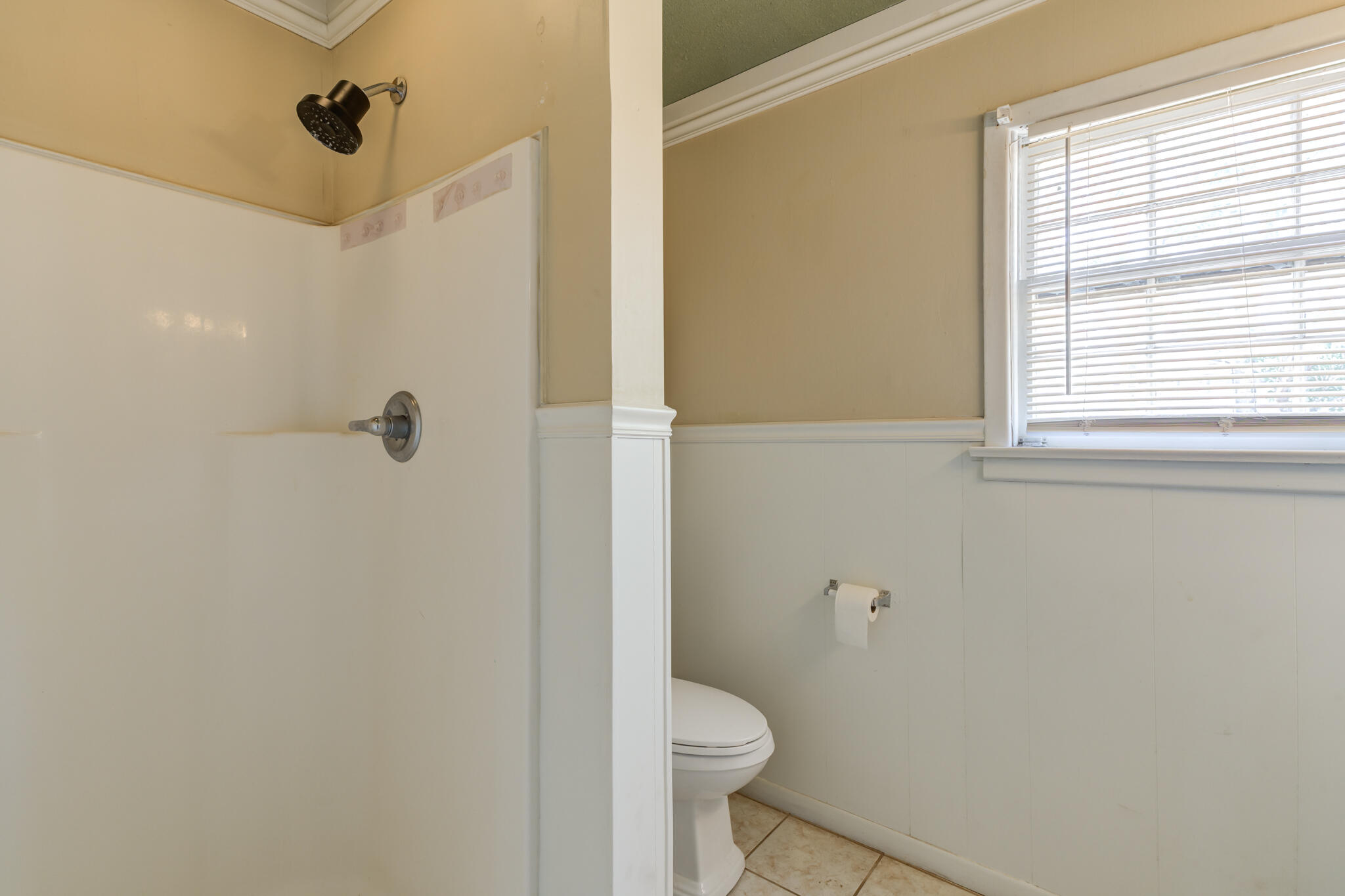 2420 39th Street Lubbock, TX 79412 - Photo 27 of 39 a bathroom with a toilet and a shower
