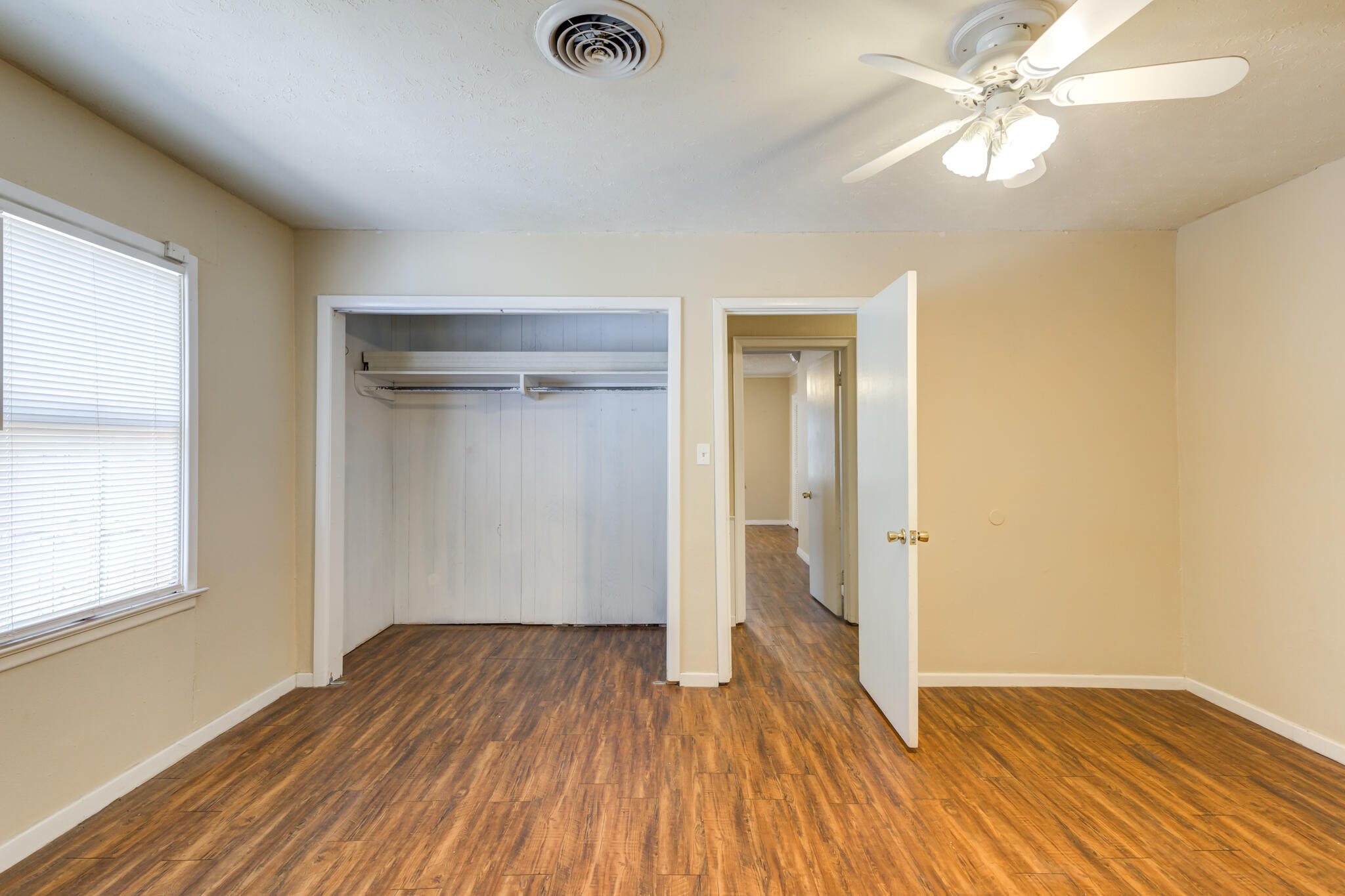 2420 39th Street Lubbock, TX 79412 - Photo 28 of 39 wooden floor in an empty room with a window
