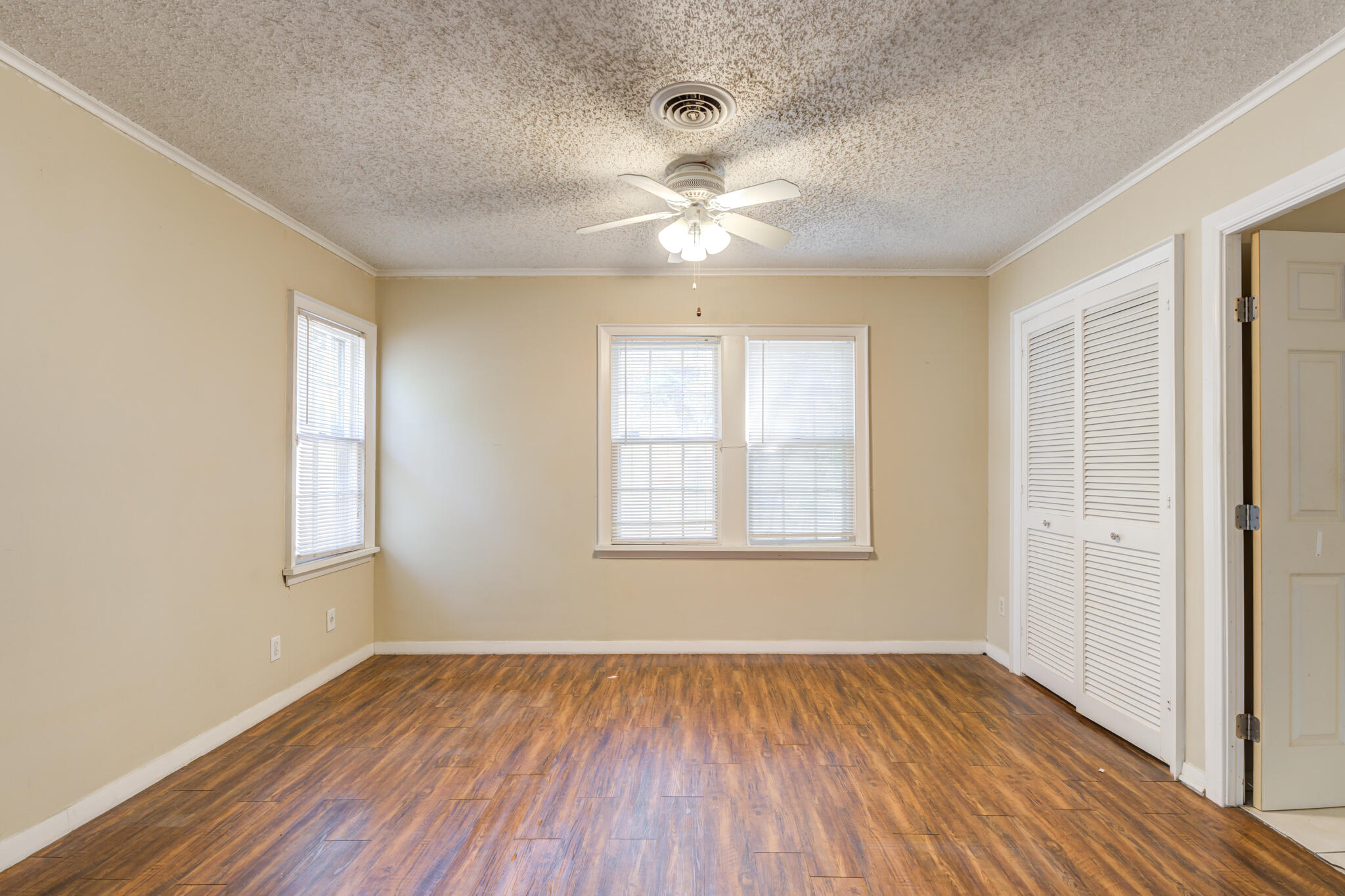 2420 39th Street Lubbock, TX 79412 - Photo 30 of 39 a view of an empty room with wooden floor and a window