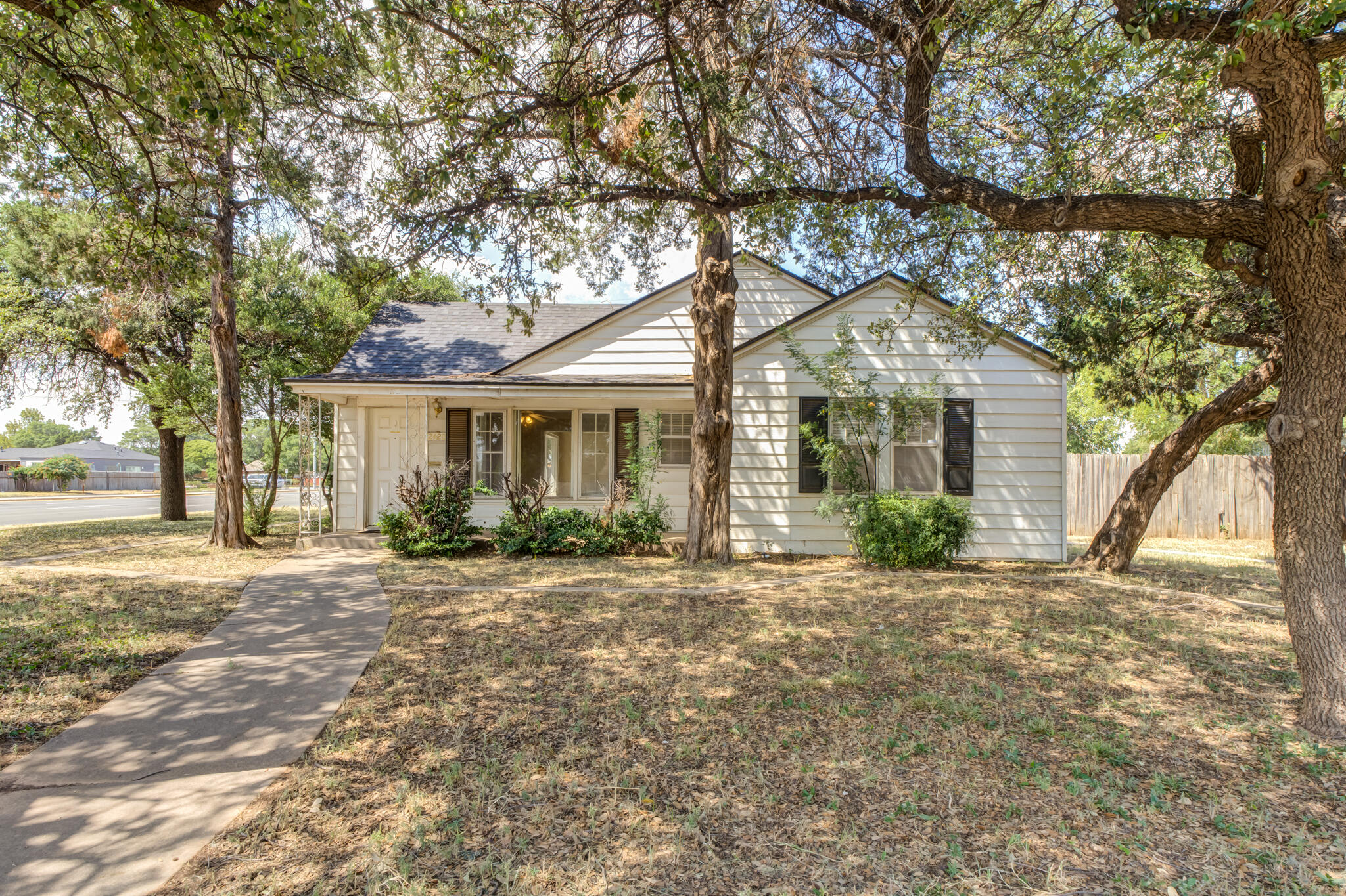 2420 39th Street Lubbock, TX 79412 - Photo 3 of 39 a front view of a house with a yard
