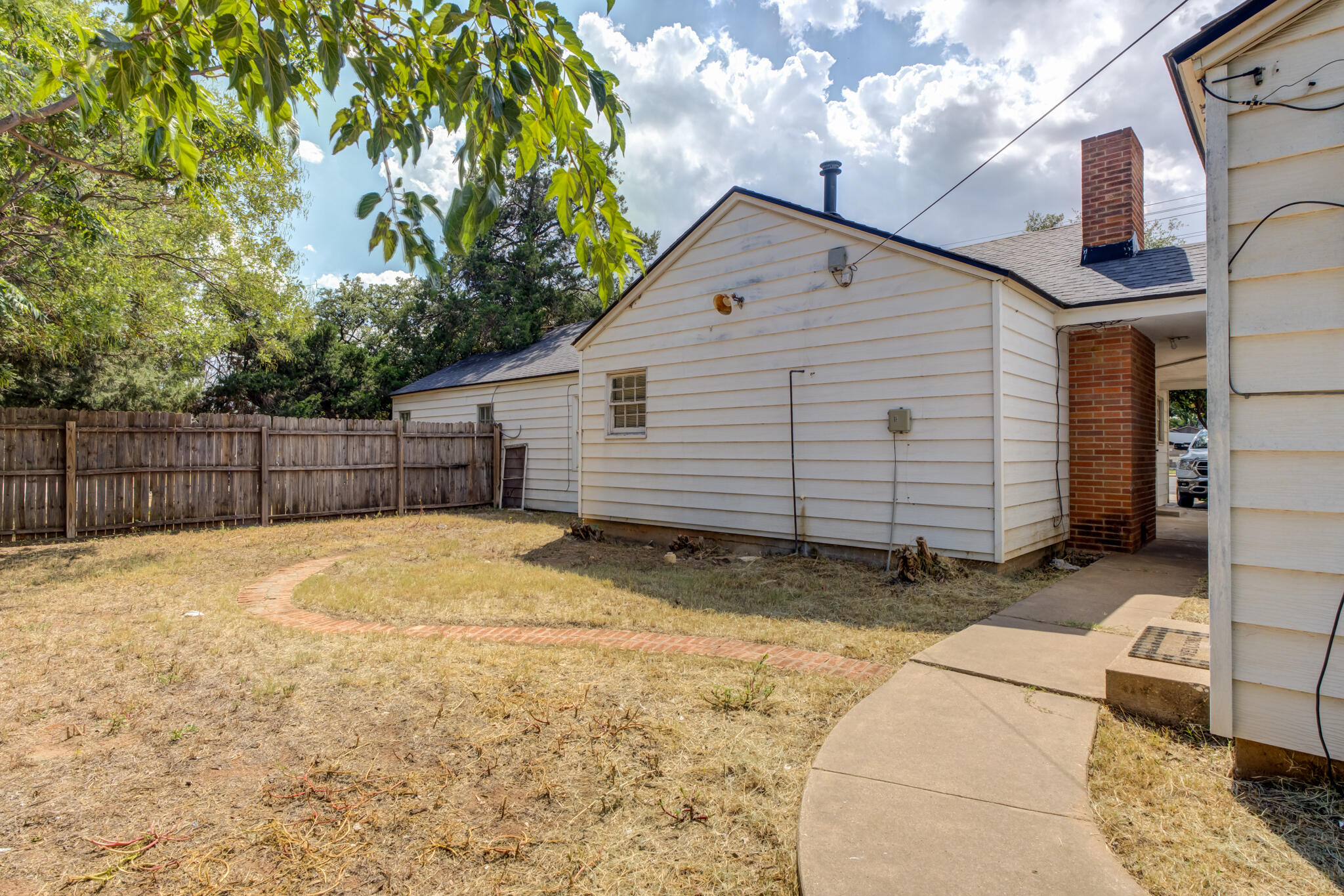 2420 39th Street Lubbock, TX 79412 - Photo 35 of 39 a view of backyard of house with garage