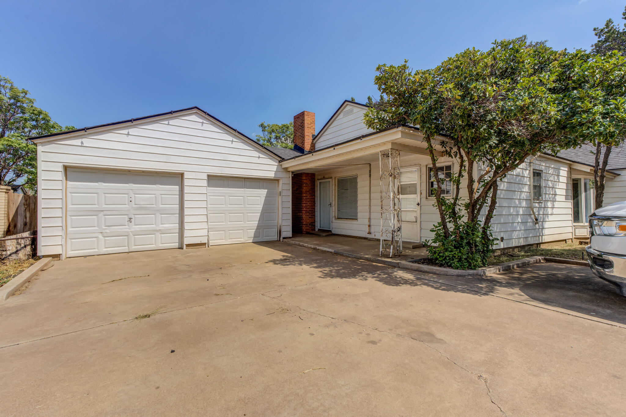 2420 39th Street Lubbock, TX 79412 - Photo 39 of 39 a front view of a house with a yard and garage