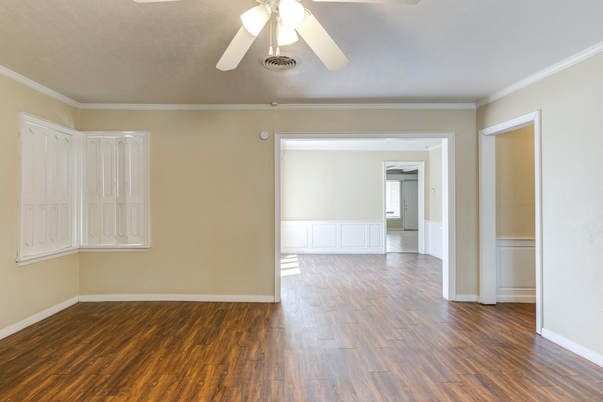 2420 39th Street Lubbock, TX 79412 - Photo 10 of 39 wooden floor in an empty room with a window