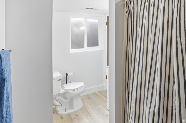 5108 South 2000th Street West Roy, UT 84067 - Photo 41 of 61 Bathroom featuring a shower with curtain and light wood finished floors