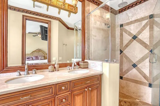 a bathroom with a double vanity sink and a mirror
