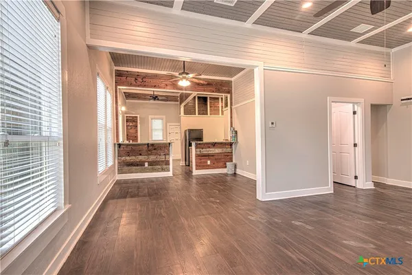 a view of a livingroom with wooden floor