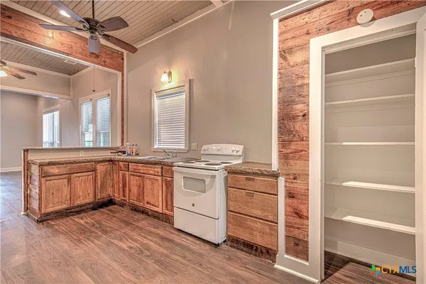 a kitchen with stainless steel appliances granite countertop a stove and a sink