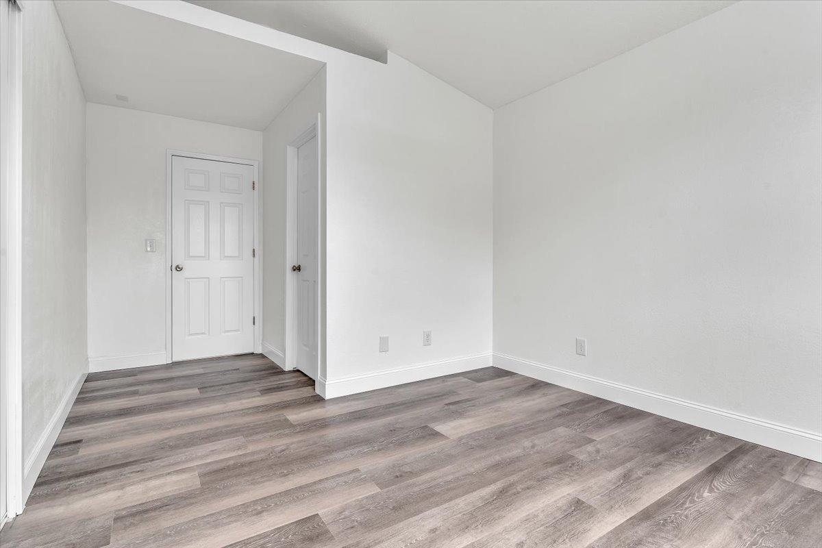 191 Orit Avenue Parlier, CA 93648 - Photo 7 of 25 a view of an empty room with wooden floor
