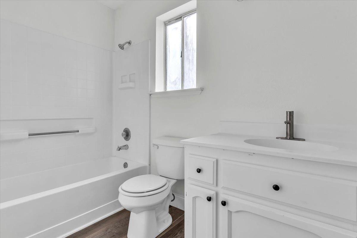 191 Orit Avenue Parlier, CA 93648 - Photo 9 of 25 a bathroom with a sink a toilet and shower