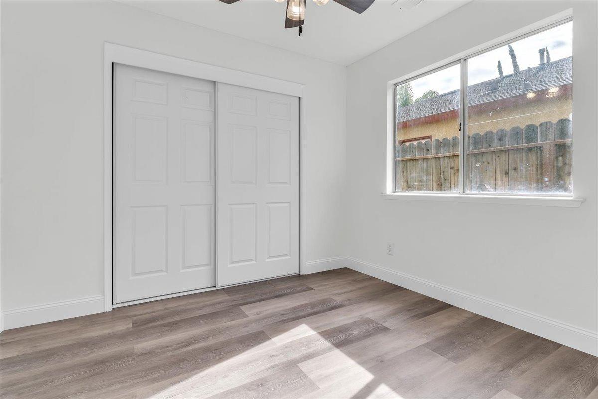 191 Orit Avenue Parlier, CA 93648 - Photo 10 of 25 a view of an empty room with a window