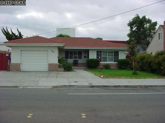 25 West 18th Street Antioch, CA 94509 - Photo 1 of 1 a front view of a house with a yard and a garage