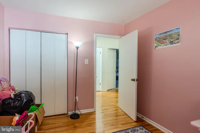 a view of a room with wooden floor
