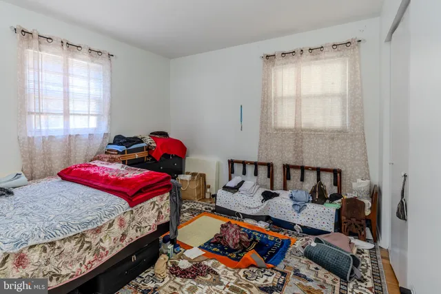 a bed room with a bed and a window