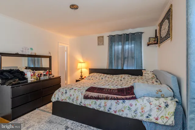 a bedroom with a bed furniture and a window