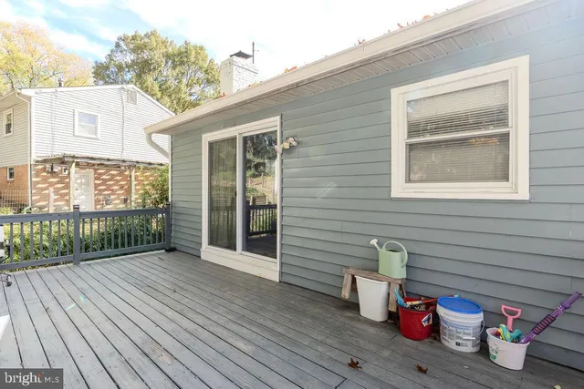 a view of an outdoor space with wooden floor and a balcony
