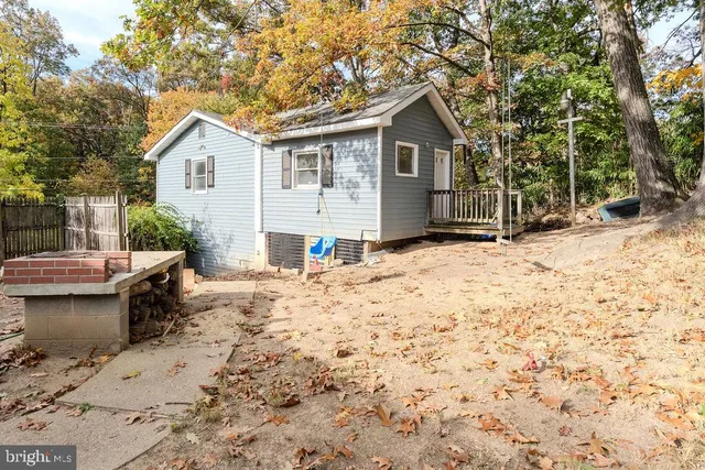 a view of a backyard with a sitting area