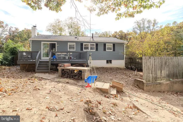 a front view of a house with swing chairs