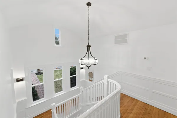 a view of a room with wooden floor