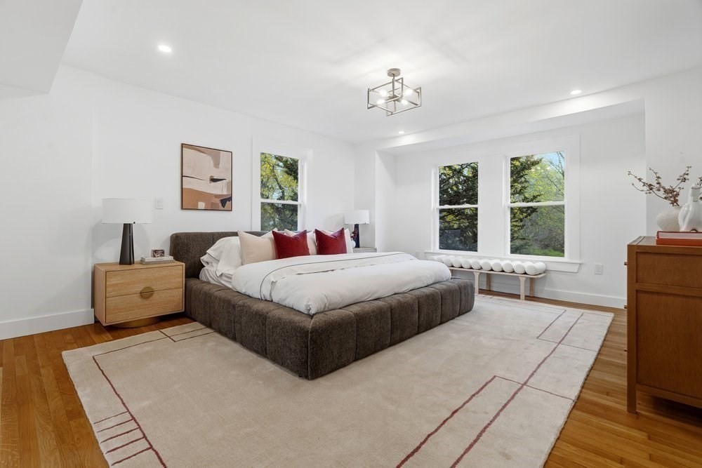1806 Beacon Street Newton, MA 02468 - Photo 17 of 38 a bed room with a bed and a table