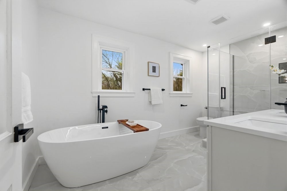 1806 Beacon Street Newton, MA 02468 - Photo 19 of 38 a bathroom with a bathtub and shower