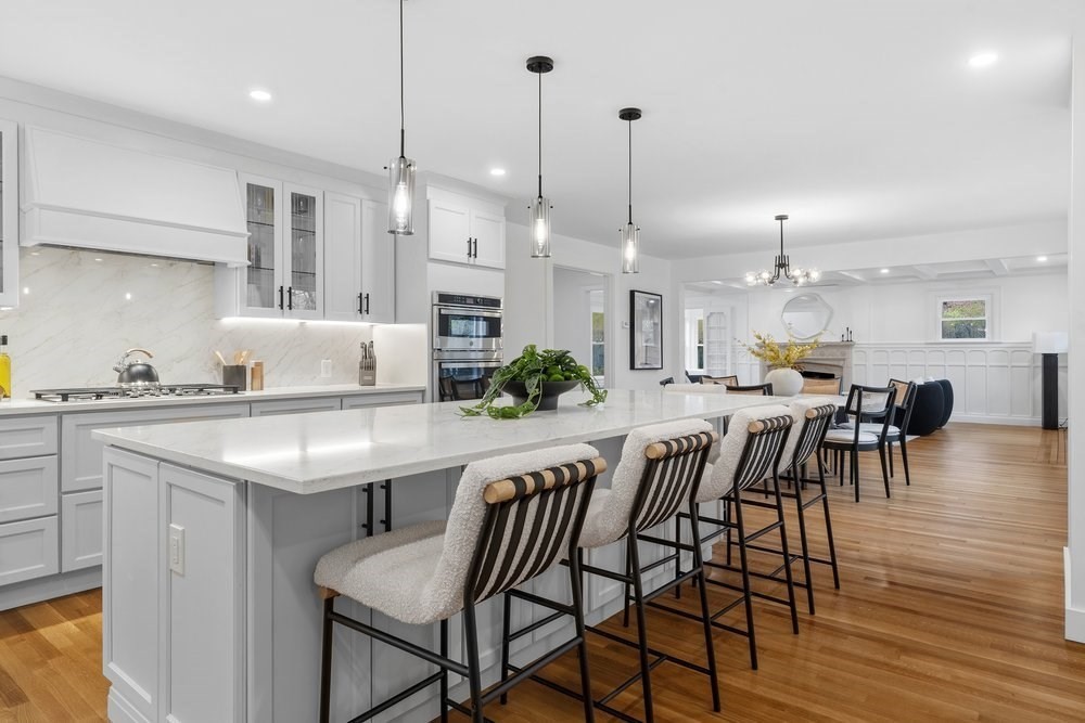 1806 Beacon Street Newton, MA 02468 - Photo 2 of 38 a kitchen with a table chairs stove and wooden floor