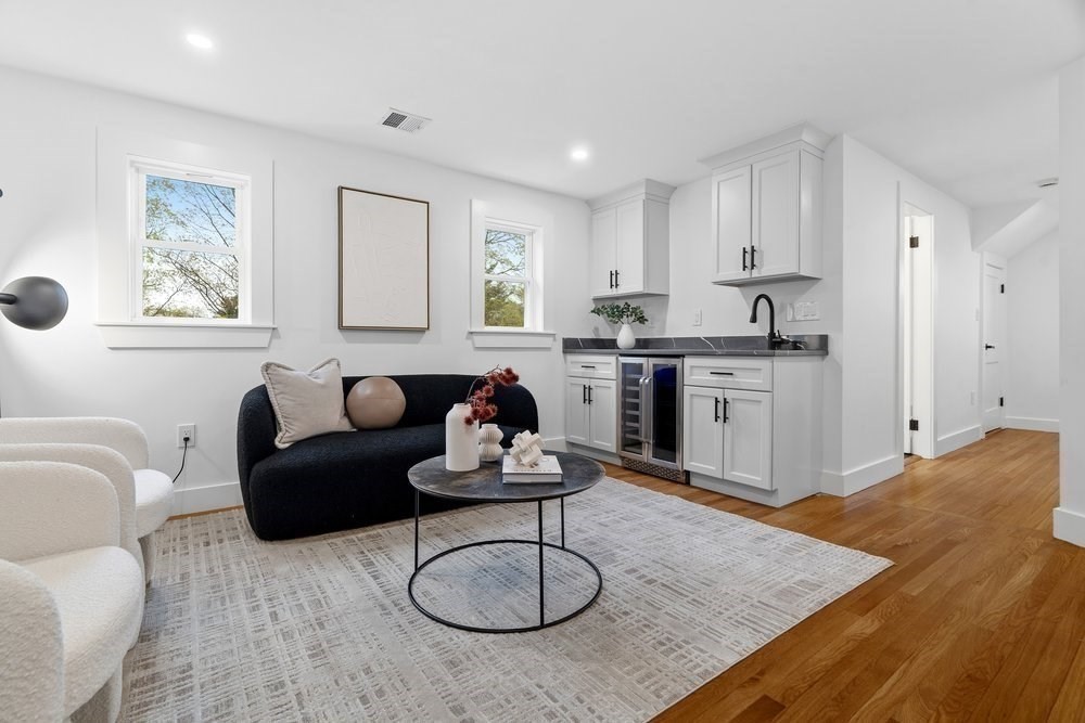 1806 Beacon Street Newton, MA 02468 - Photo 25 of 38 a living room with furniture a rug kitchen view and a window
