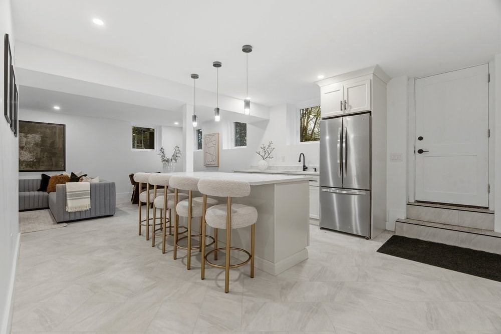 1806 Beacon Street Newton, MA 02468 - Photo 28 of 38 a kitchen with stainless steel appliances a refrigerator a table and chairs