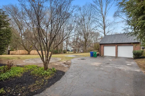 a view of a house with a yard and garage