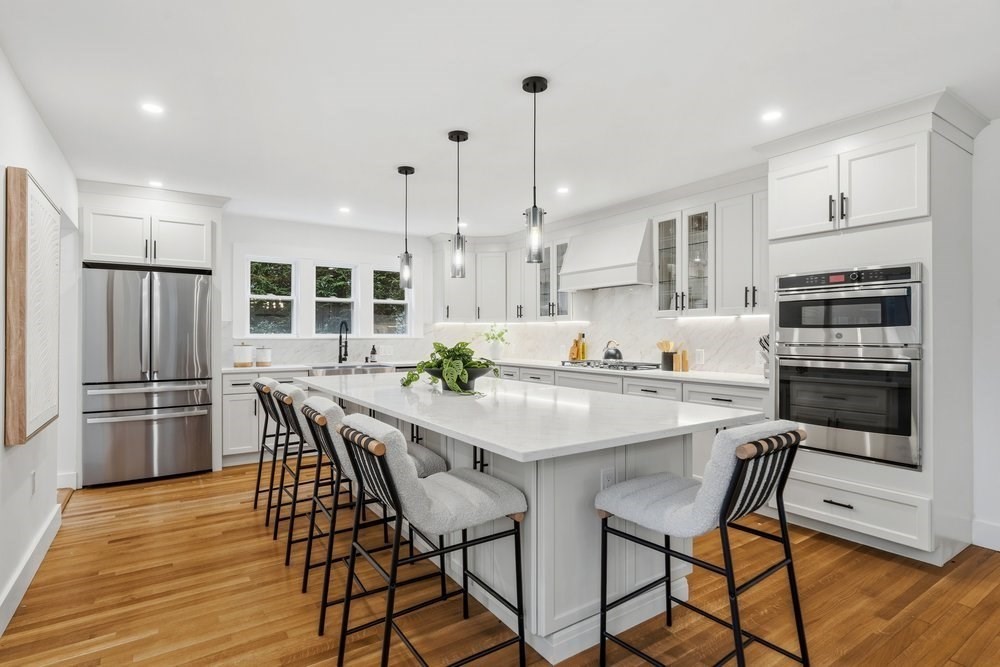 1806 Beacon Street Newton, MA 02468 - Photo 3 of 38 a kitchen with stainless steel appliances kitchen island granite countertop a kitchen island hardwood floor and a sink