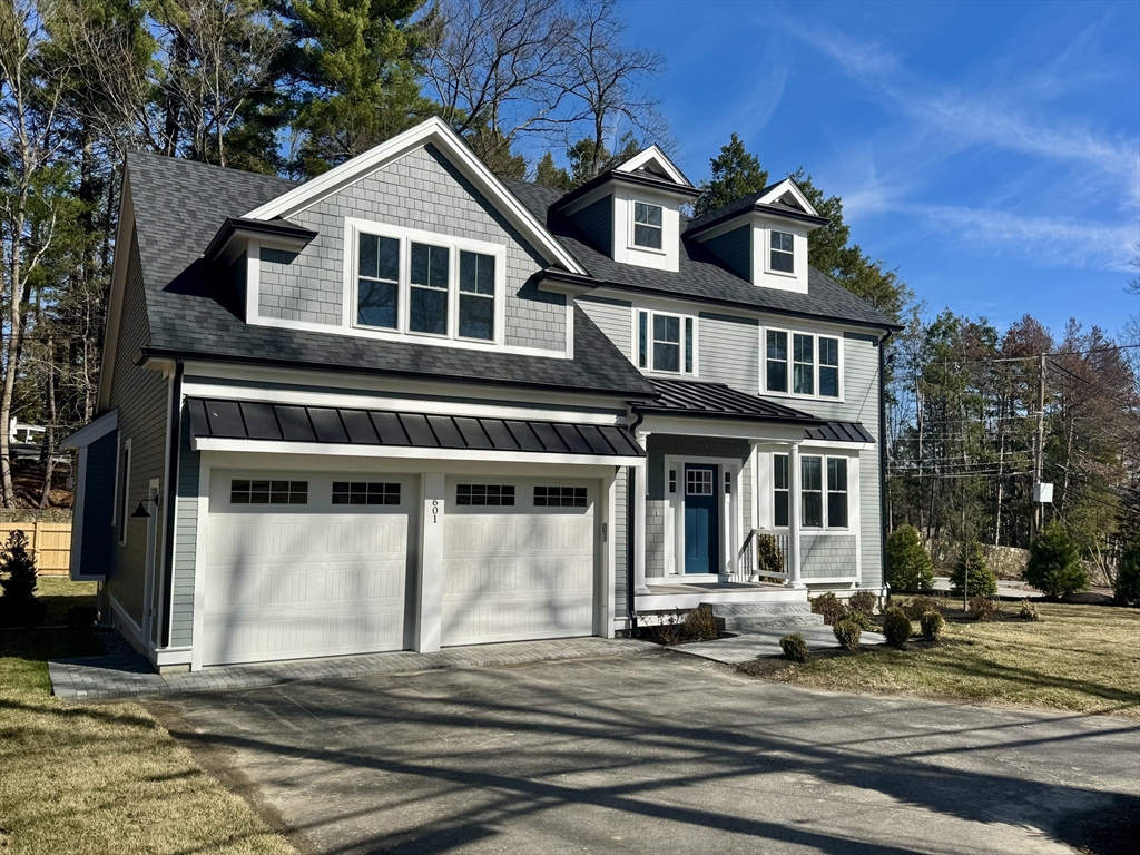 601 Salem End Road Framingham, MA 01702 - Photo 1 of 42 a front view of a house with a yard