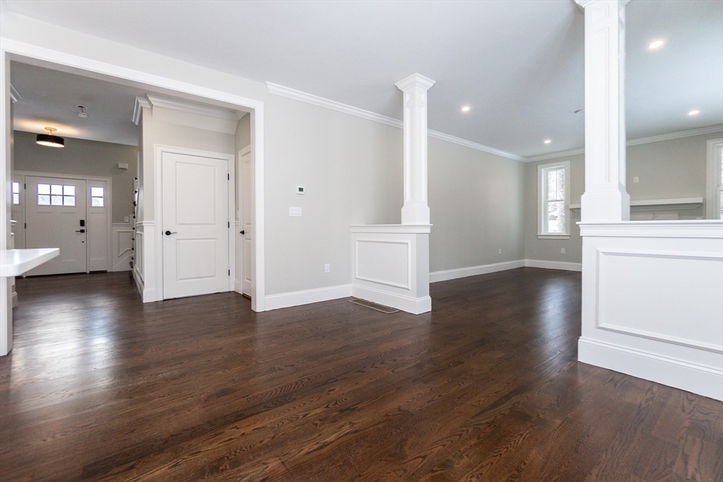 601 Salem End Road Framingham, MA 01702 - Photo 15 of 42 a view of a big room with wooden floor and windows