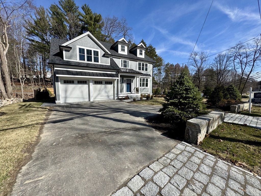 601 Salem End Road Framingham, MA 01702 - Photo 2 of 42 a front view of a house with a yard