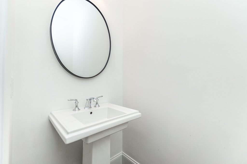 601 Salem End Road Framingham, MA 01702 - Photo 23 of 42 a bathroom with a sink and a mirror