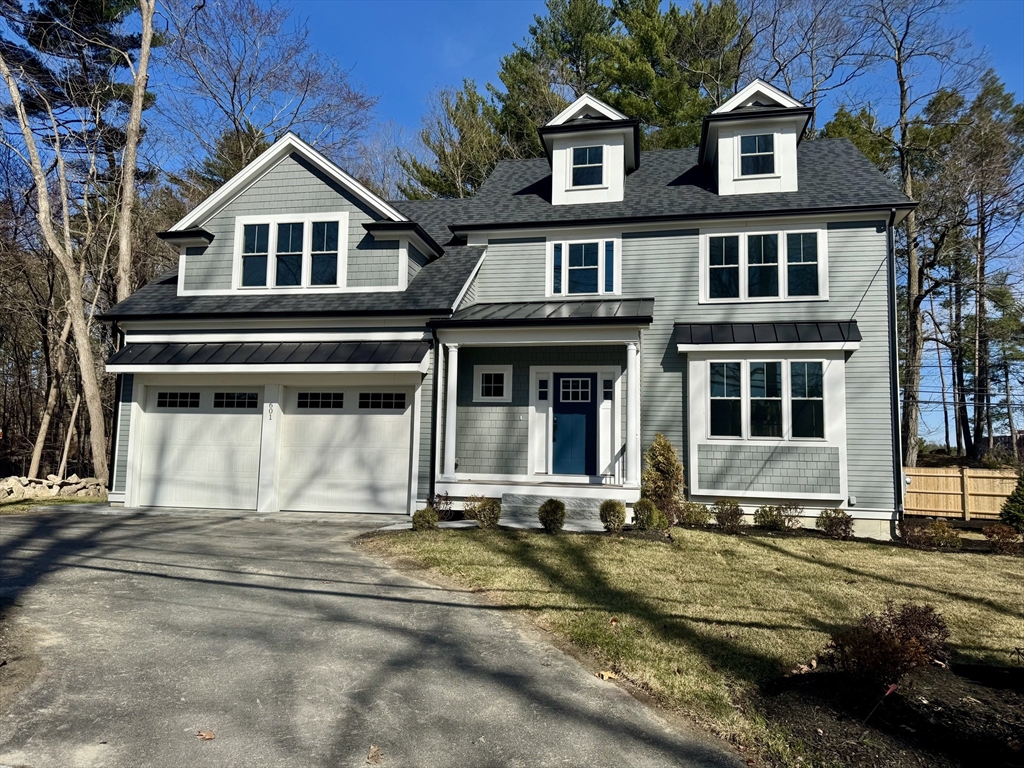601 Salem End Road Framingham, MA 01702 - Photo 3 of 42 a front view of a house with a yard