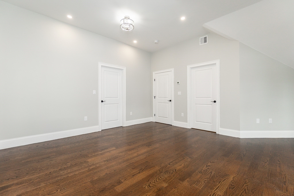601 Salem End Road Framingham, MA 01702 - Photo 33 of 42 an empty room with wooden floor