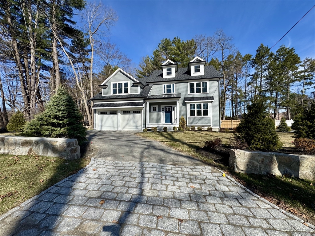 601 Salem End Road Framingham, MA 01702 - Photo 4 of 42 a front view of a house with a yard