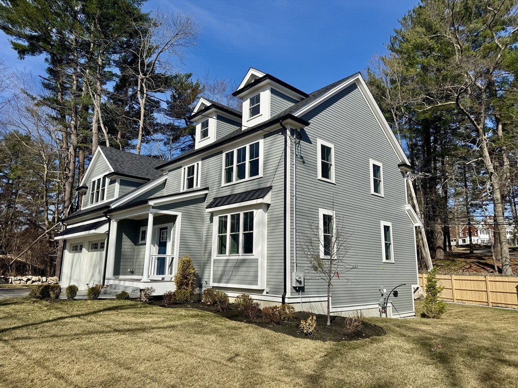 601 Salem End Road Framingham, MA 01702 - Photo 5 of 42 a front view of a house with a yard