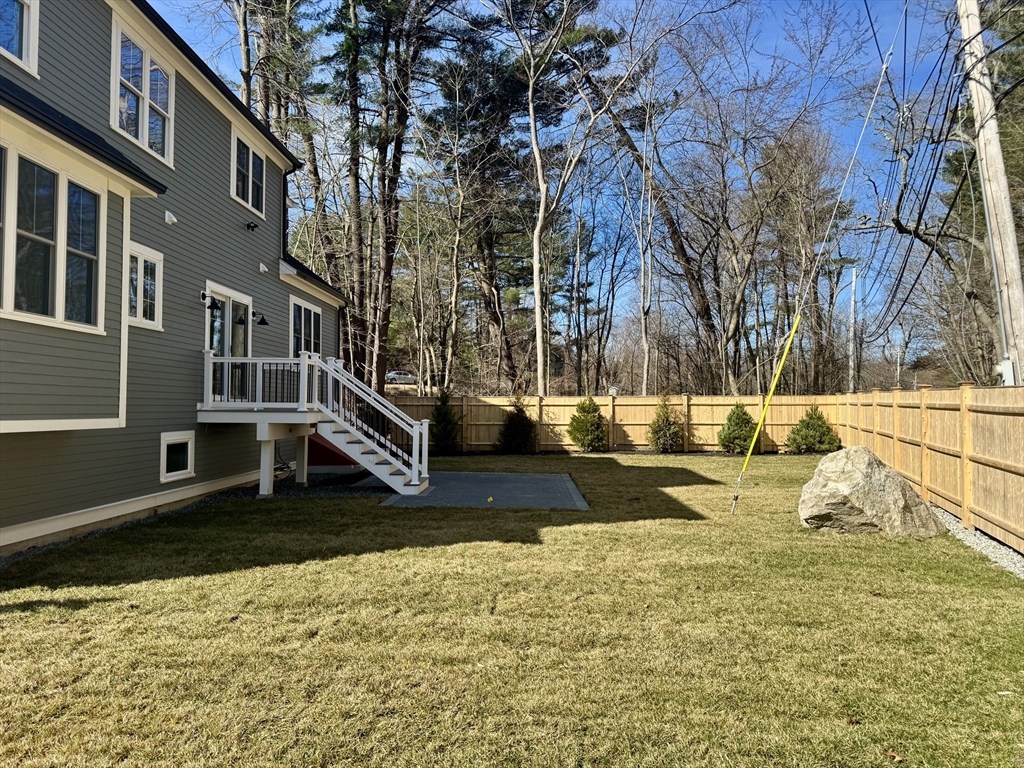 601 Salem End Road Framingham, MA 01702 - Photo 8 of 42 a view of small yard with large trees