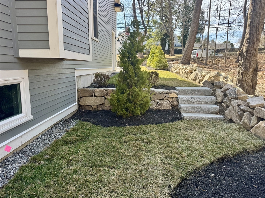 601 Salem End Road Framingham, MA 01702 - Photo 10 of 42 a view of a garden with large tree