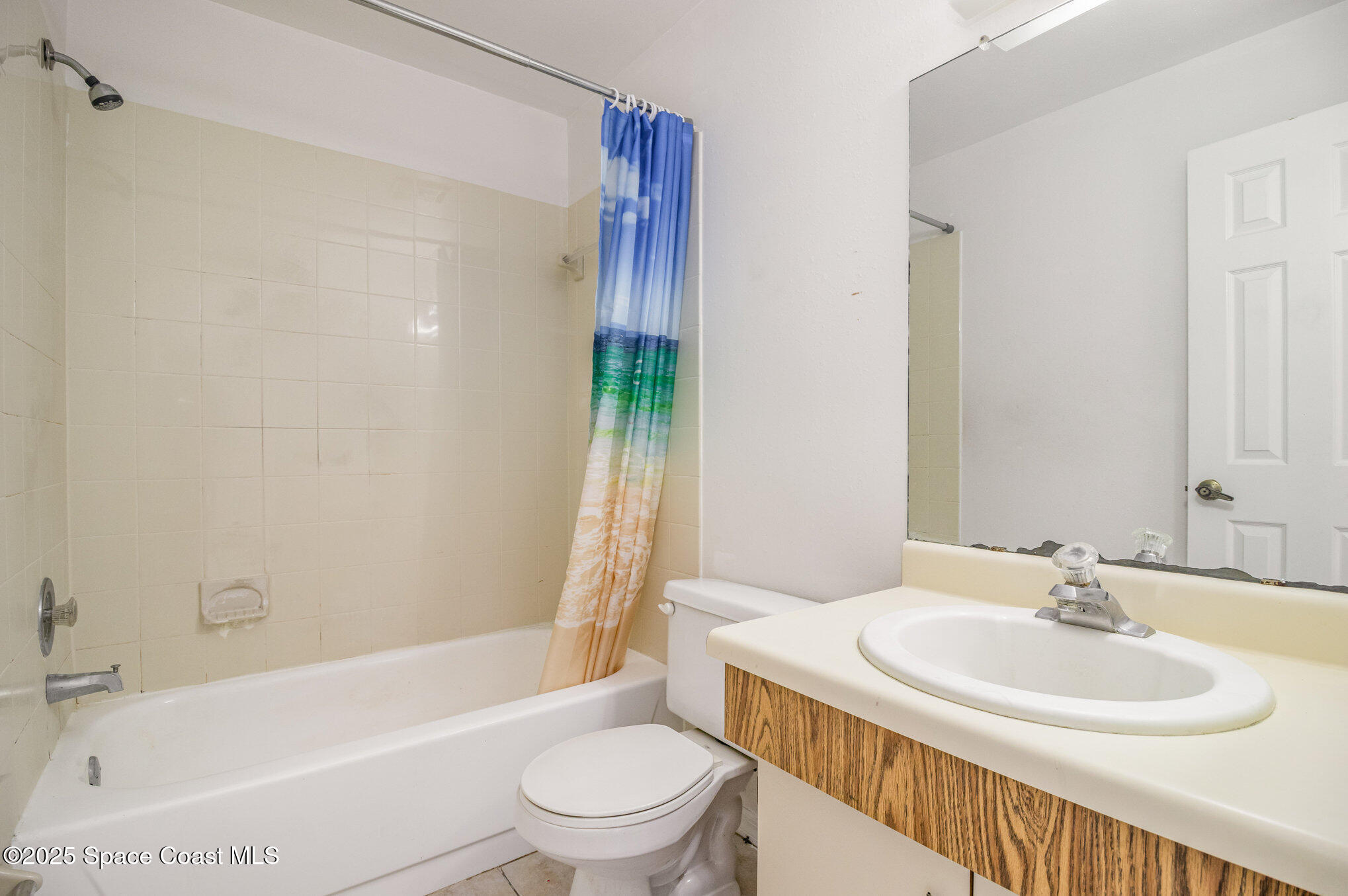 1515 Huntington Lane, Unit 626 Rockledge, FL 32955 - Photo 13 of 14 a bathroom with a sink toilet and shower