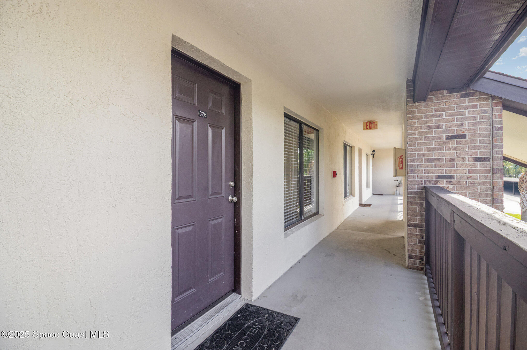 1515 Huntington Lane, Unit 626 Rockledge, FL 32955 - Photo 2 of 14 a hallway with a livingroom view