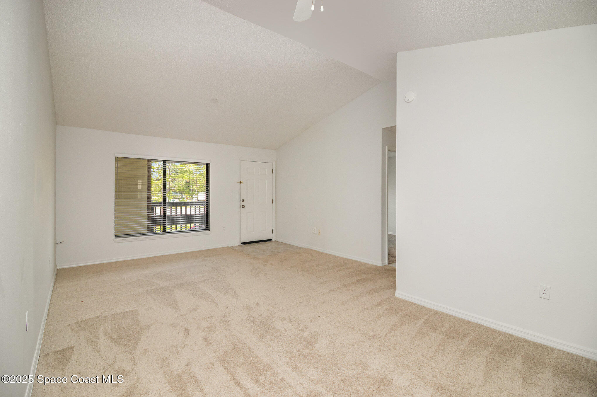 1515 Huntington Lane, Unit 626 Rockledge, FL 32955 - Photo 3 of 14 a view of an empty room with a window