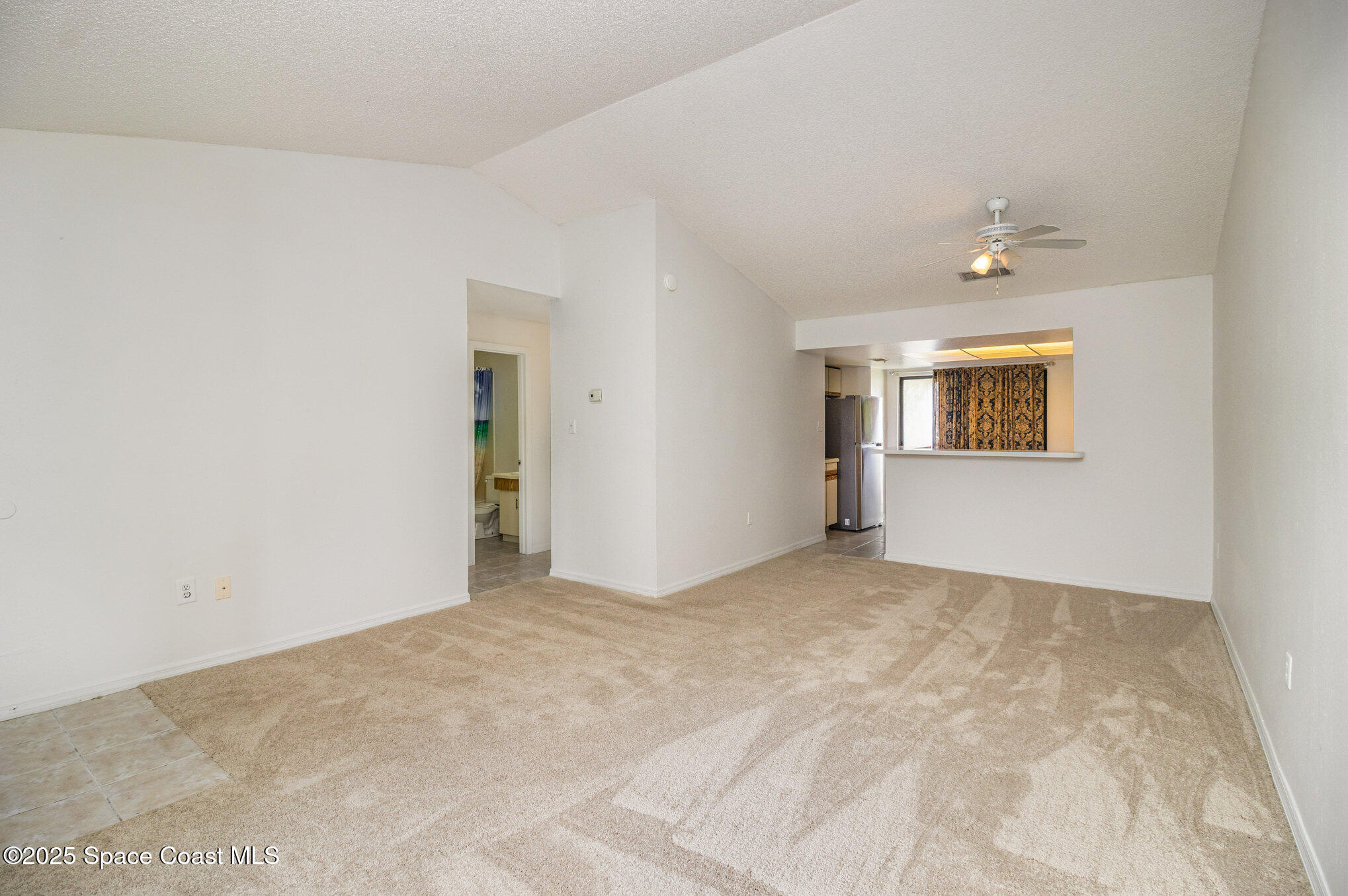1515 Huntington Lane, Unit 626 Rockledge, FL 32955 - Photo 4 of 14 a view of an empty room with a window