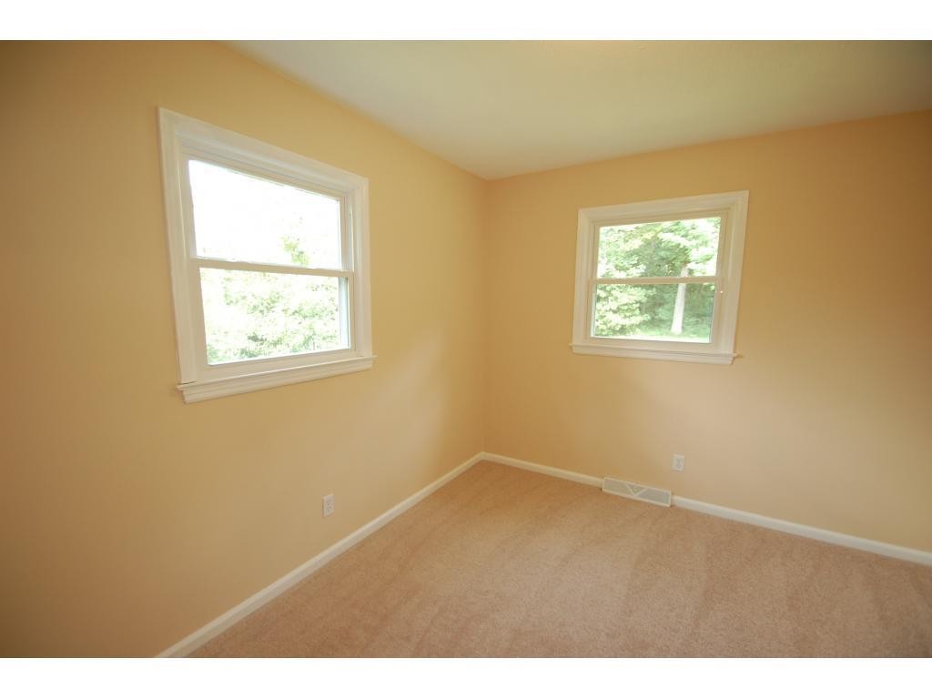 401 Lancaster Road Mebane, NC 27302 - Photo 11 of 15 a view of an empty room with wooden floor and a window