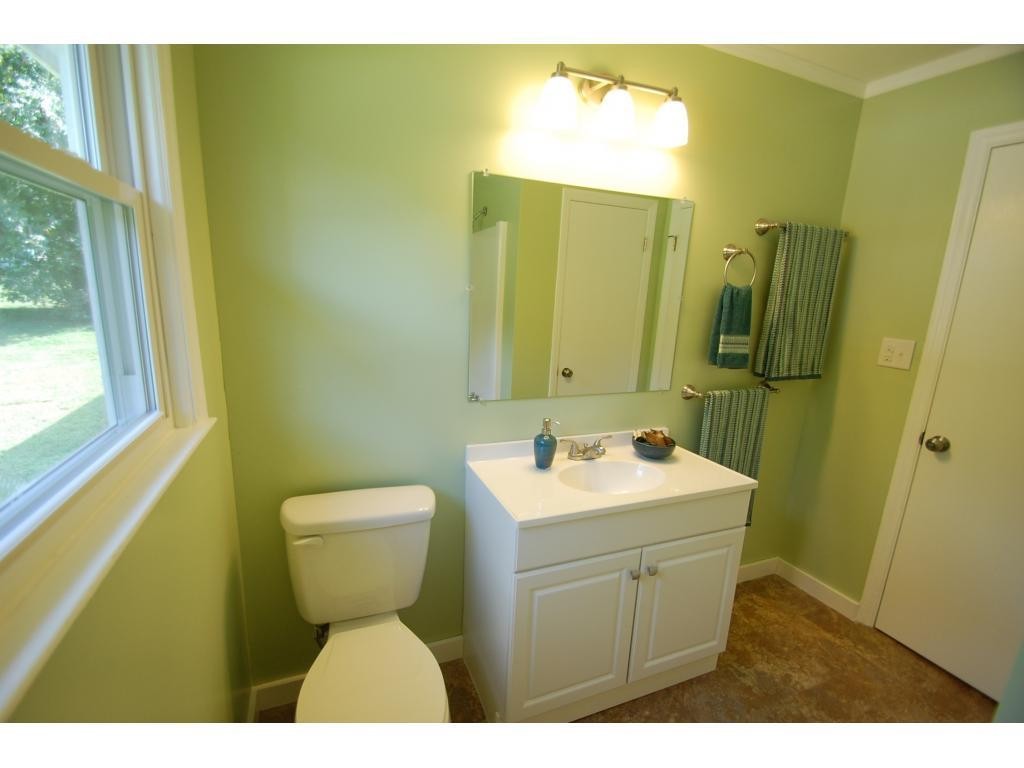 401 Lancaster Road Mebane, NC 27302 - Photo 12 of 15 a bathroom with a sink toilet and mirror