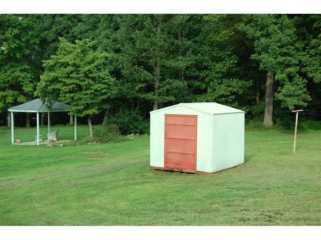 401 Lancaster Road Mebane, NC 27302 - Photo 14 of 15 a view of a backyard with a garden and entertaining space