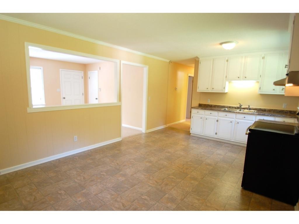 401 Lancaster Road Mebane, NC 27302 - Photo 8 of 15 a view of a kitchen with wooden floor and a kitchen