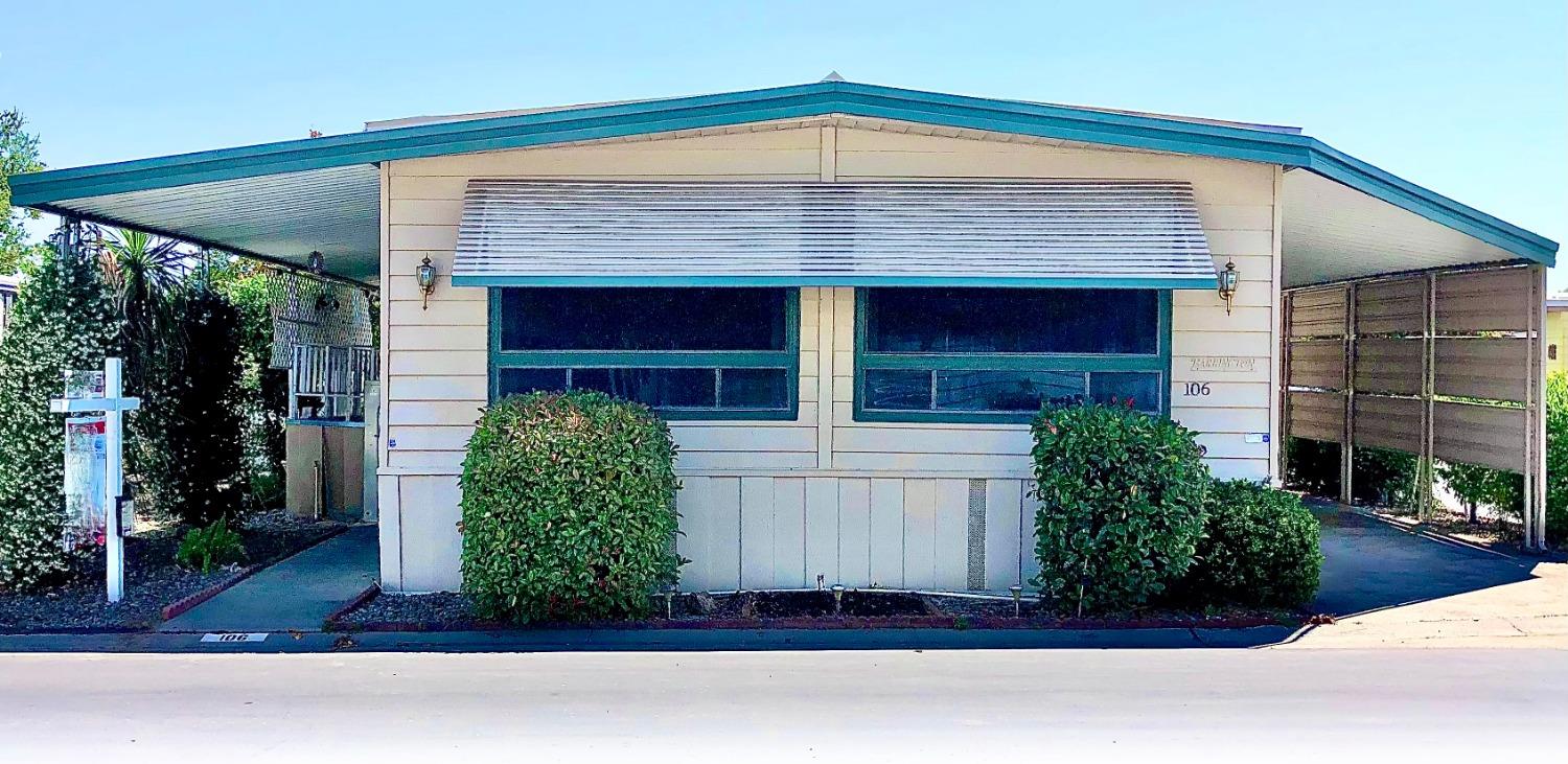 5040 Jackson Street, Unit 106 North Highlands, CA 95660 - Photo 1 of 16 a front view of a house with a yard
