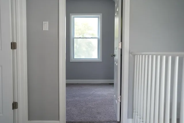 a view of staircase with window