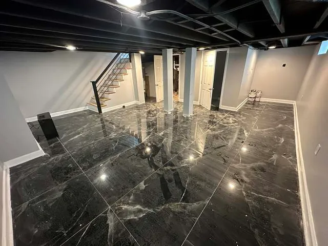 a white toilet sitting next to a bathroom sink